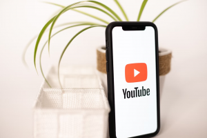 Youtube logo on a phone screen Youtube logo on a phone screen